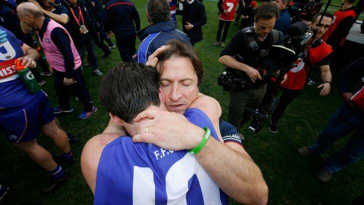 Skipper Easton Wood shares a moment with Luke Beveridge. Photo: AFL Media/Getty Images