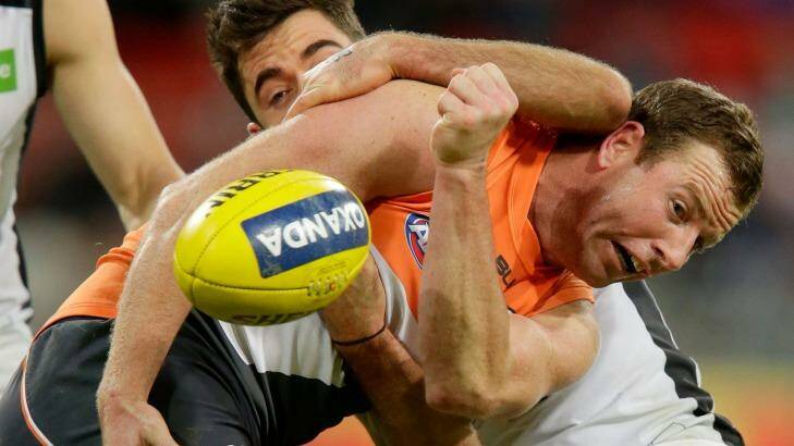 Starring role: Steve Johnson is tackled by Kade Simpson of the Blues.  Photo: Darrian Traynor/AFL Media/Getty