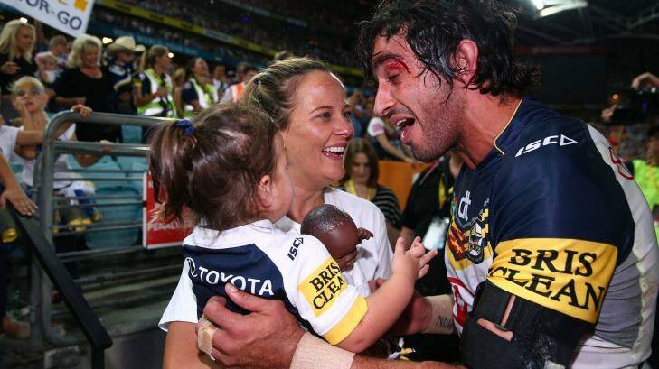 Fitting reward: Johnathan Thurston celebrates victory with his fiancee Samantha Lynch and daughter Frankie.  Photo: Cameron Spencer