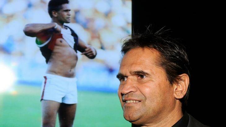 Passionate: Nicky Winmar at the launch of the AFL Indigenous Round in 2013. In the background is the famous picture of him taking a stand against racism.  Photo: Sebastian Costanzo