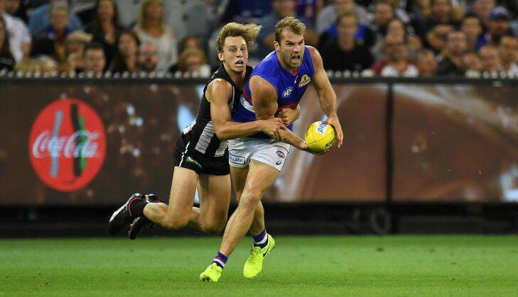 Chris Mayne of the Magpies (left) and Stewart Crameri of the Bulldogs contest during the Round 1 AFL match between the Collingwood Magpies and Western Bulldogs at the MCG in Melbourne, Friday, March 24, 2017. (AAP Image/Julian Smith) NO ARCHIVING, EDITORIAL USE ONLY SINGLE USE PRINT & ONLINE $$
.