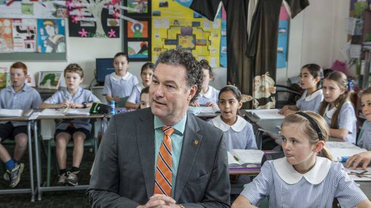 Minister for Education John-Paul Langbroek at Fig Tree Pocket State School spruiking the governments second-language message. Photo: Glenn Hunt