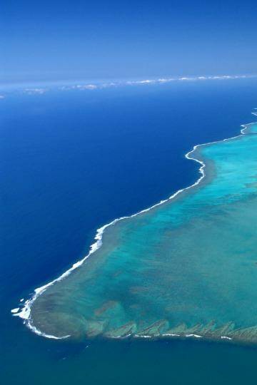 View from the top: Turquoise lagoon with saltwater channels and white sandy beach. Photo: None