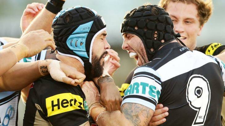 Michael Ennis of the Sharks, right, wrestles with Jamie Soward of the Panthers after the Lewis hit on Moylan. Photo: Matt King