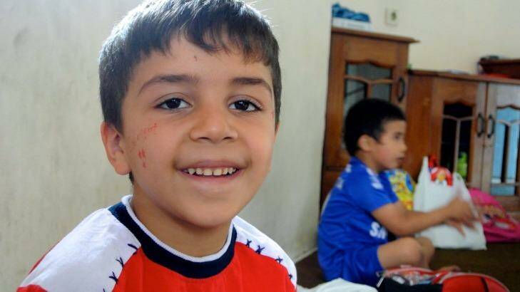 All smiles: A young boy at the learning centre. Photo: Michael Bachelard