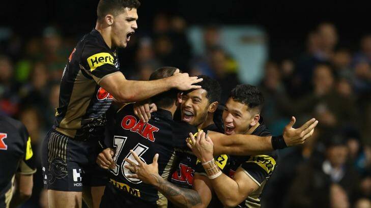 Staying put:  Nathan Cleary celebrates a Panthers try against the Rabbitohs. Photo: Mark Kolbe