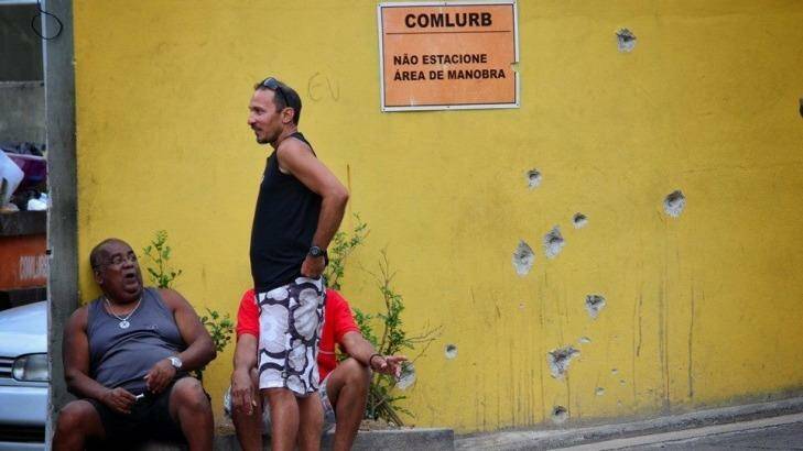 Bullet holes are seen on a wall in Rio's Complexo do Alemao favela. Photo: Carlos Coutinho