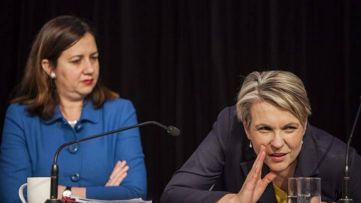Guess what ... we're back in the game. Labor's federal deputy opposition leader Tanya Plibersek gives the word with Queensland opposition leader Annastacia Palaszczuk. Photo: Glenn Hunt