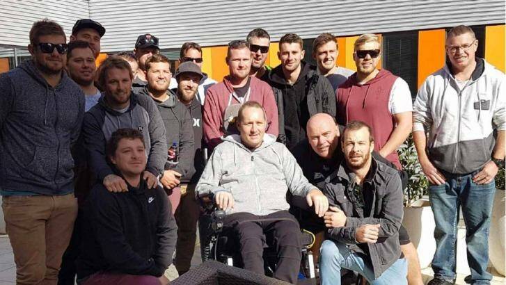 Here for you, mate: The Windale Eagles with injured teammate Damian Jobson. Photo: Supplied