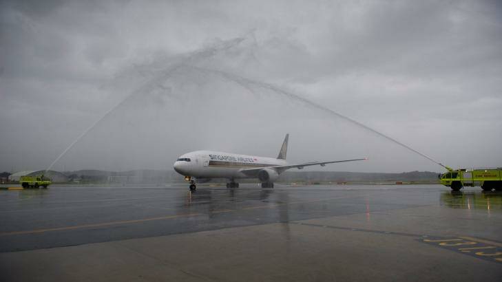 Water cannon greeted the first Singapore Airlines flight. Photo: Jay Cronan