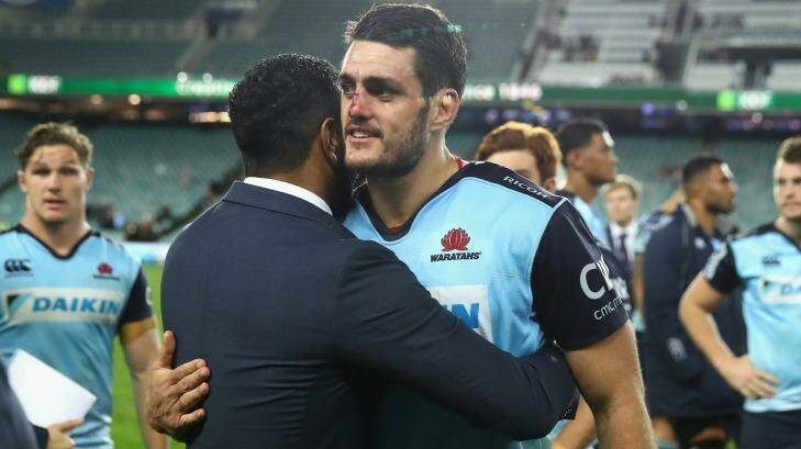Home farewell: Injured Waratahs star Kurtley Beale and Dave Dennis embrace following the final home game of the year last weekend. Photo: Cameron Spencer