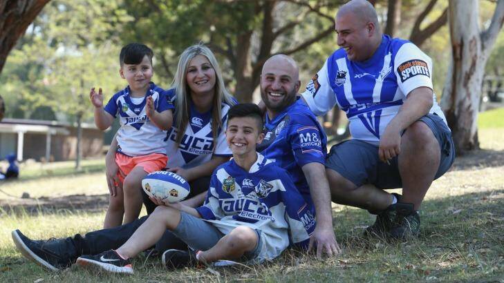 Supporters for life: Ali Jawad with his extended family of Bulldogs fans. Photo: Britta Campion