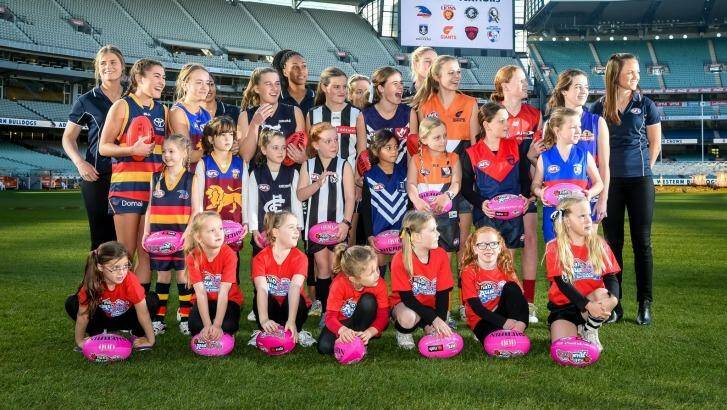 Daisy Pearce (far right) with fellow players and potential future stars at the launch of the league. Photo: Justin McManus