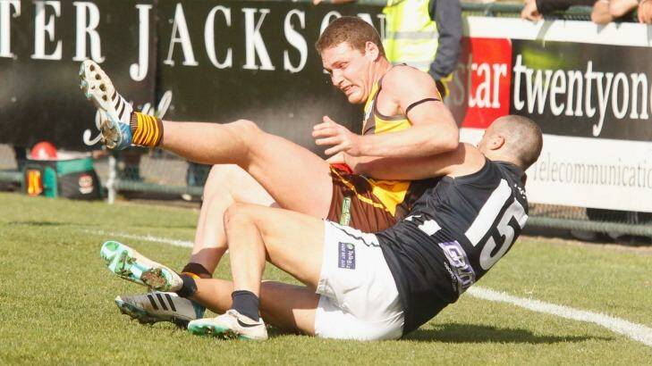 Grimley is tackled during the VFL match between Box Hill Hawks and Northern Blues in 2014.  Photo: Chris Hopkins