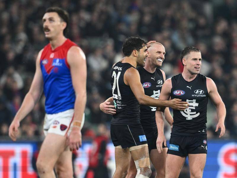 Carlton have withstood a Demons fightback in driving rain for a gripping win at the MCG. (Joel Carrett/AAP PHOTOS)