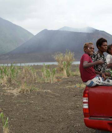 Danger zone: Matupit villagers in front of Mount Tavurvur volcano near Rabaul, Papua New Guinea. Photo: Janie Barrett