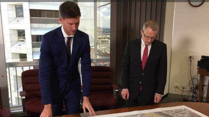The long and the short of highway funding: Main Roads Minister Mark Bailey talks M1 funding with his federal counterpart, Urban Infrastructure Minister Paul Fletcher in Brisbane. Photo: Tony Moore