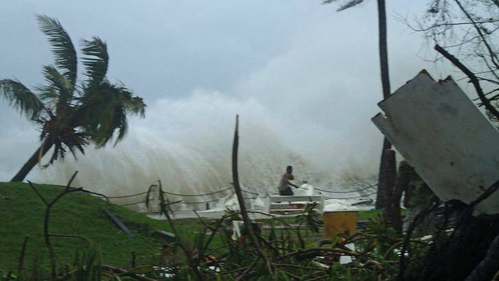 High-risk neighbourhood: High waves caused by Cyclone Pam crashing along the coast in the Vanuatu capital of Port Vila.  Photo: Inga Mepham