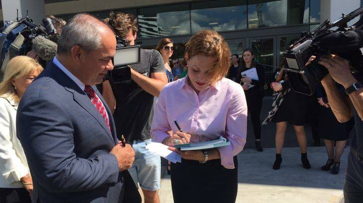 Deputy Premier Jackie Trad discusses the draft South East Queensland plan with Gold Coast Mayor Tom Tate. Photo: Tony Moore