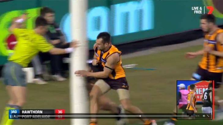 Hawthorn captain Luke Hodge bumps into Chad Wingard very close to the goalpost. Photo: Channel Seven