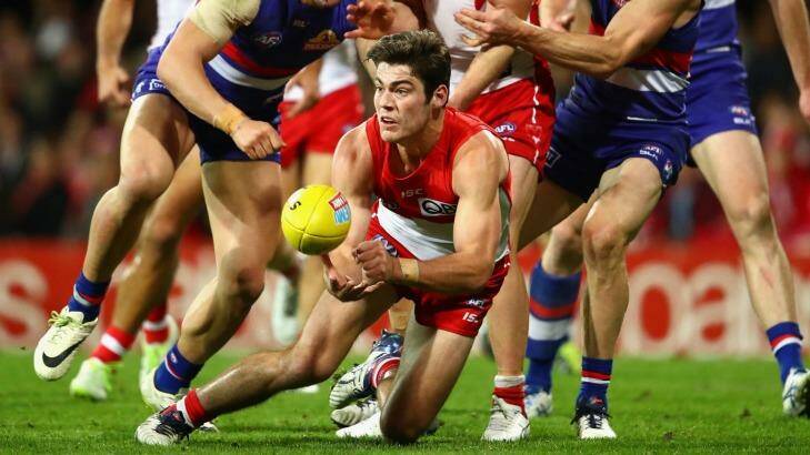 George Hewett of the Swans handpasses during the loss to the Bulldogs.