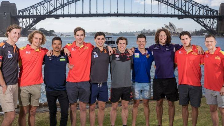 The top 10 picks pose in front of the Sydney Harbour Bridge on Saturday morning. Photo: Daniel Boud