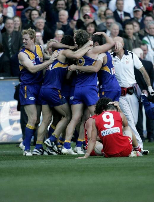 The Eagles celebrate moments after the siren. Photo: John Donegan