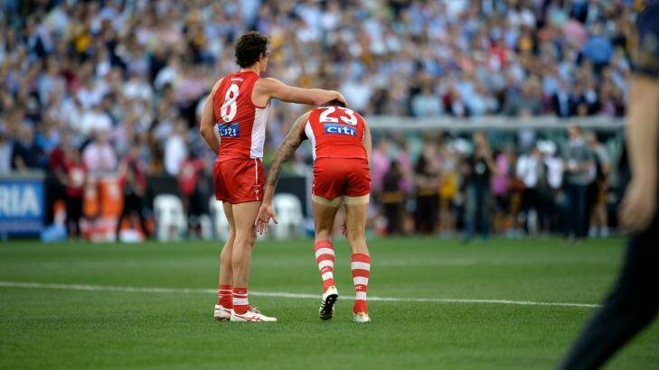Painful: Sydney's key forwards, Kurt Tippett and Buddy Franklin, commiserate after their grand final loss. Photo: Justin McManus