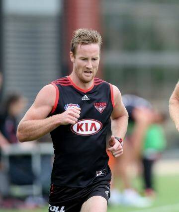 Dustin Fletcher (right), preparing for a remarkable 23rd season, is still seen as a vital piece in defence, while the clever Jason Winderlich (left) had a strong 2014 and made the right call to play on. Photo: Pat Scala