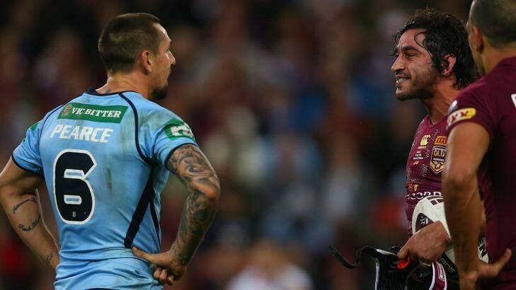 Sledgehammer: Johnathan Thurston gives Mitchell Pearce a form assessment. Photo: Getty Images 