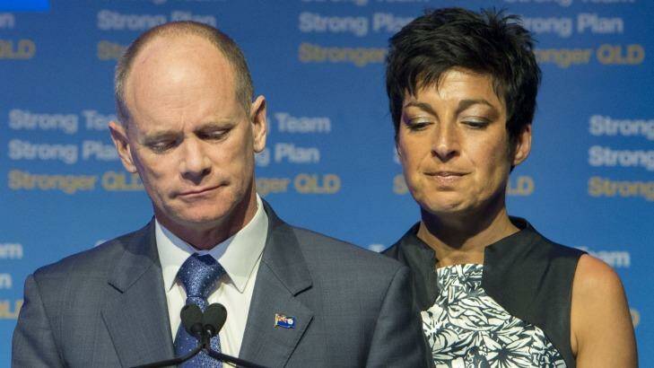 Campbell Newman speaks to LNP supporters, flanked by his wife Lisa. Photo: Glenn Hunt