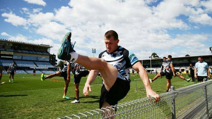 At a stretch: Paul Gallen warms up for a Cronulla Sharks training session at Southern Cross Group Stadium this week. Photo: Matt King