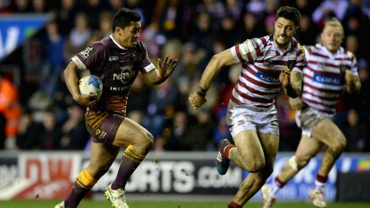 Repeat clash: Anthony Milford runs away from Wigan defenders in 2015. Photo: Gareth Copley