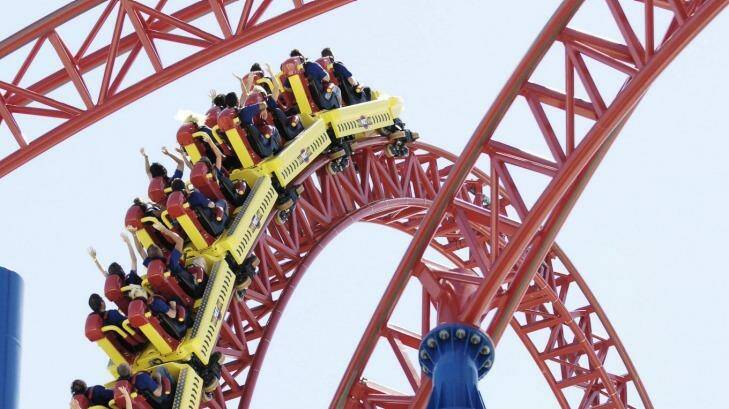 A woman is suing Movie World after falling off a flower bed at the popular theme park.