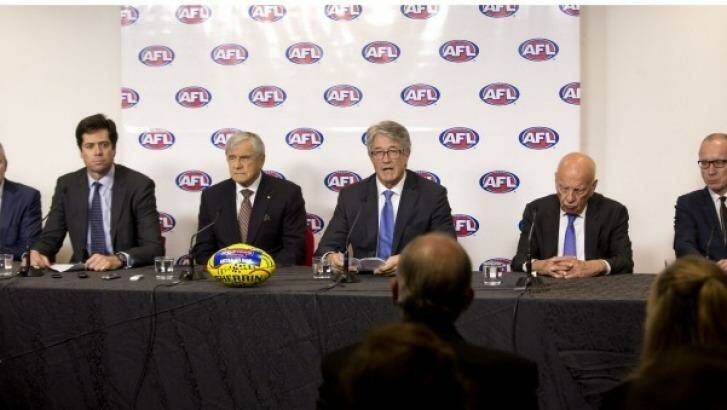 AFL chief executive Gillon McLachlan with (left to right) Kerry Stokes, AFL chairman Mike Fitzpatrick, and Rupert Murdoch as they announce the record-breaking deal. Photo: Simon O'Dwyer