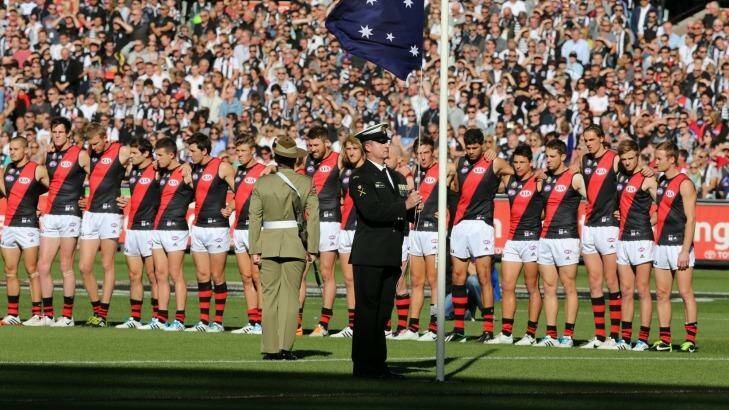 Lest we forget: Essendon players line up for the national anthem at the MCG last year. Photo: Wayne Taylor