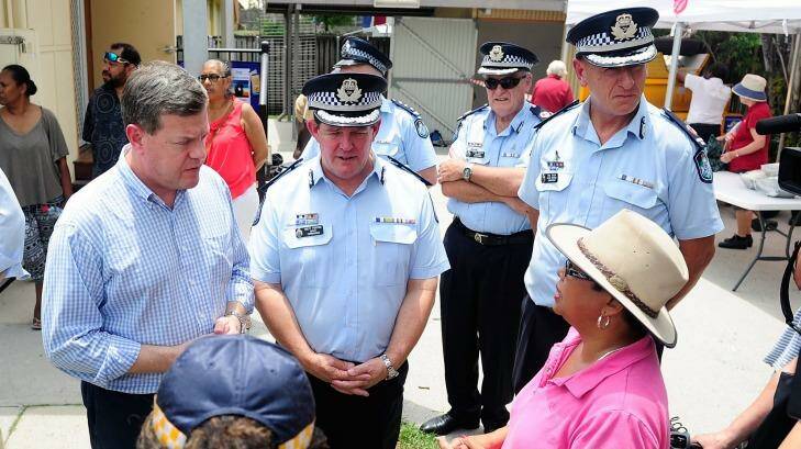 Acting Queensland Premier Tim Nicholls and senior police speak to Cairns community advocate Yodie Batzke. Photo: Ian Hitchcock