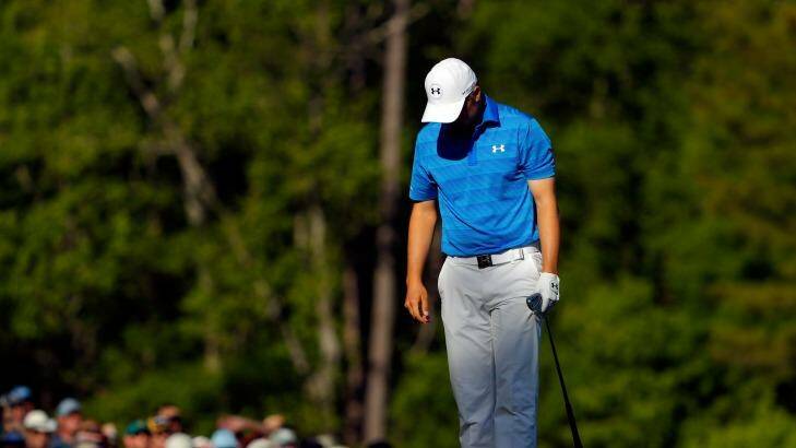 Jordan Spieth reacts after hitting his tee shot into the water on the 12th. Photo: Kevin C. Cox