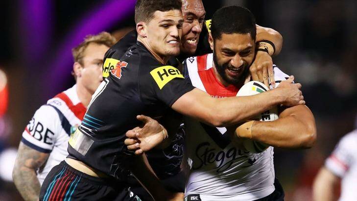 Defesive prowess: Nathan Cleary helps bring Isaac Liu down. Photo: Brendon Thorne