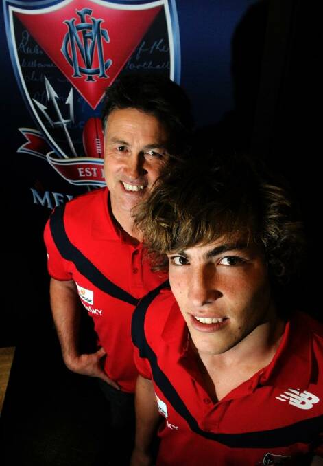Todd Viney's son Jack is now an important member of Melbourne's midfield. The two are pictured in 2010. Photo: Sebastian Costanzo