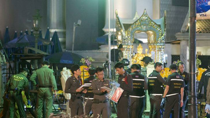 Police investigate the scene at the Erawan Shrine after an explosion in Bangkok,Thailand, Monday, Aug. 17, 2015. A large explosion rocked a central Bangkok intersection during the evening rush hour, killing a number of people and injuring others, police said(AP Photo/Mark Baker) Photo: Mark Baker
