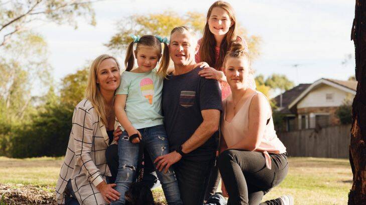 Portrait of Isla Batchelor, childhood survivor of acute lymphoblastic leukaemia, photographed with her family in Belrose. Pictured with mum Sarah, father Darrin and sisters Lily and Ainsley. Tuesday 12th September 2017. Photograph by James Brickwood. SMH NEWS 170912