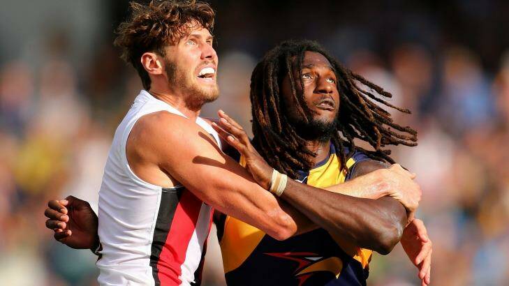 Tight tussle: Tom Hickey and Nic Naitanui during a ruck contest. Photo: Paul Kane