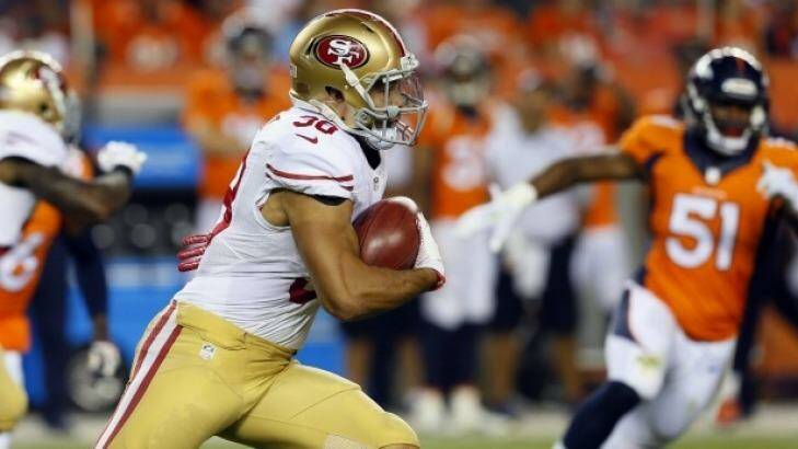 Making the most of his opportunity: San Francisco 49ers rookie Jarryd Hayne returns a kickoff during the second half of an NFL pre-season game against the Denver Broncos in Denver

 Photo: Joe Mahoney