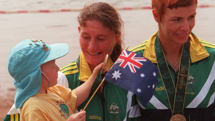 Family affair: a two-year-old Jordan Wood with mother Anna after she won bronze for Australia in Atlanta. Photo: Craig Golding