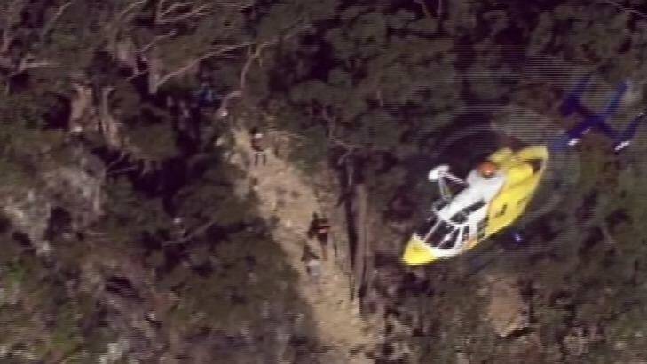 The RACQ rescue helicopter has arrived at Mount Tibrogargan. Photo: Seven News Queensland