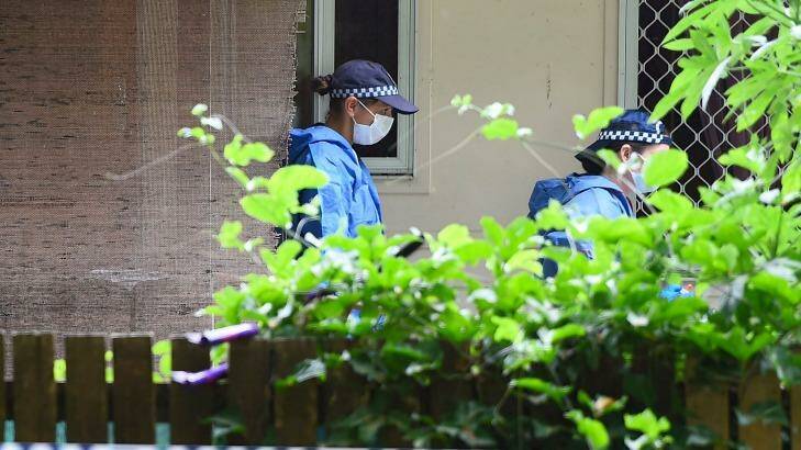 Police forensic officers continue the investigation. Photo: Ian Hitchcock
