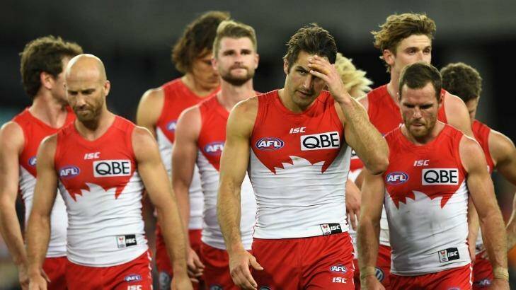 The Swans walk off after losing to the Giants. Photo: Quinn Rooney