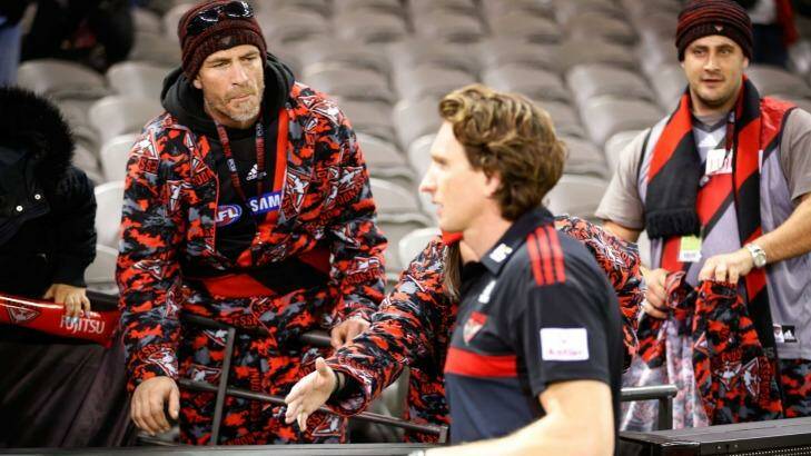 An Essendon supporter offers encouragement to coach James Hird after his team was thrashed by Adelaide. Photo: AFL Media/Getty Images