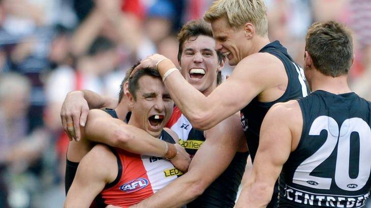 The 16th-placed Saints enjoy the win over Fremantle in round 23, 2013. Photo: Joe Armao 